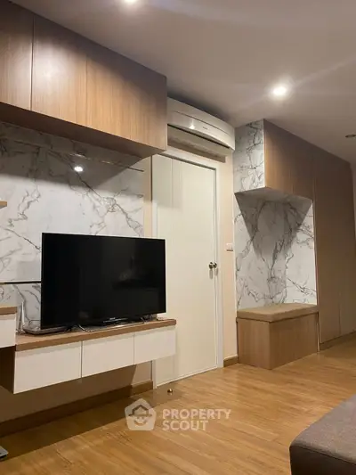 Modern living room with marble accents and wooden flooring