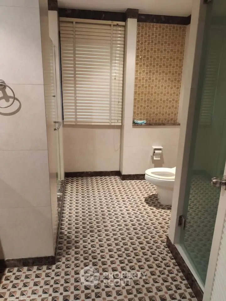 Elegant bathroom with stylish tile flooring and modern fixtures