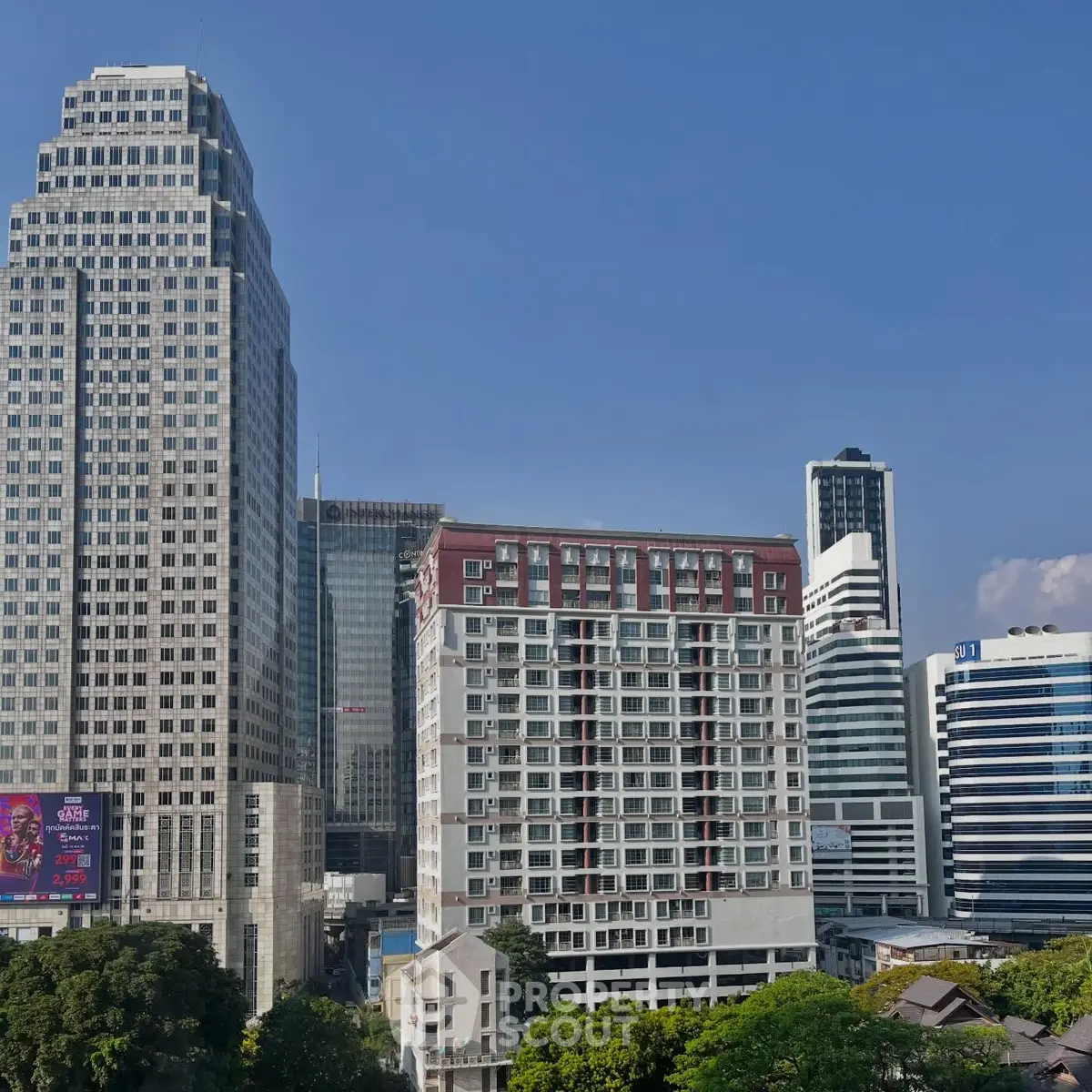 Stunning cityscape view featuring modern high-rise buildings and lush greenery.