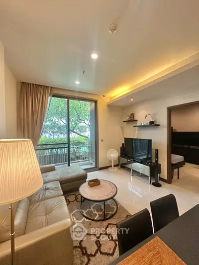 Spacious modern living room with large windows and elegant decor