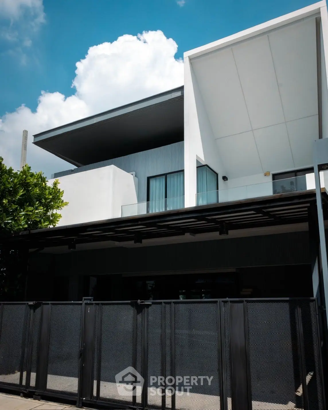 Modern architectural home with sleek design and spacious balcony