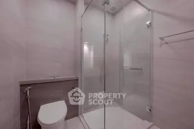 Modern bathroom with glass shower enclosure and sleek design
