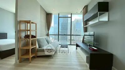 Modern living room with city view, sleek furniture, and natural light.