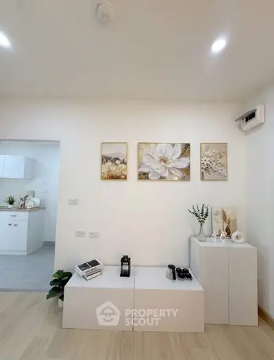 Modern interior with minimalist decor and open kitchen layout, perfect for contemporary living.