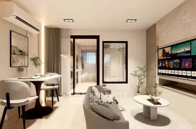 Modern living room with sleek furniture and large TV, featuring open layout and stylish decor.
