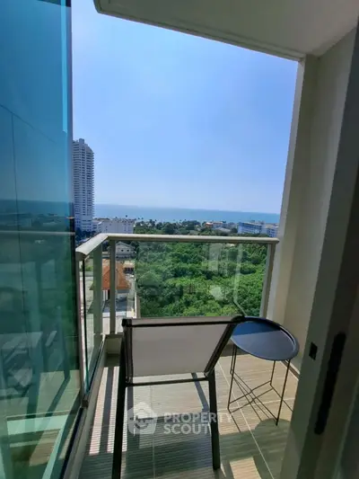 Stunning balcony with ocean view in modern high-rise apartment
