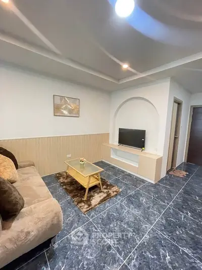 Modern living room with stylish decor and cozy seating area.