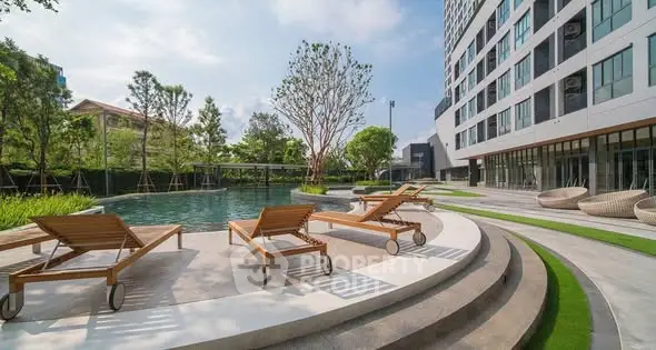 Luxurious apartment complex with serene poolside and modern architecture.