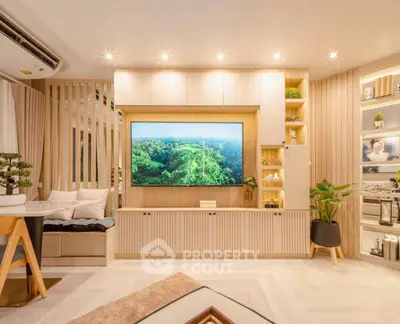 Modern living room with stylish decor and large TV display