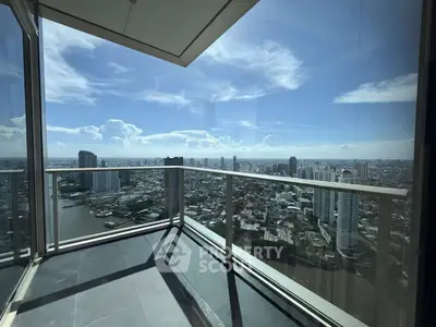 Stunning high-rise balcony with panoramic city and river views, perfect for urban living.