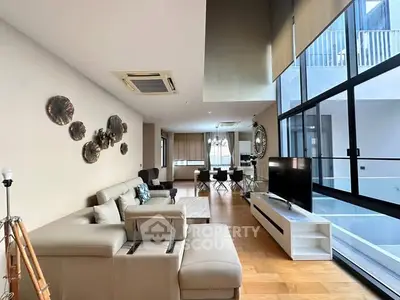 Luxurious modern living room with high ceilings and elegant decor