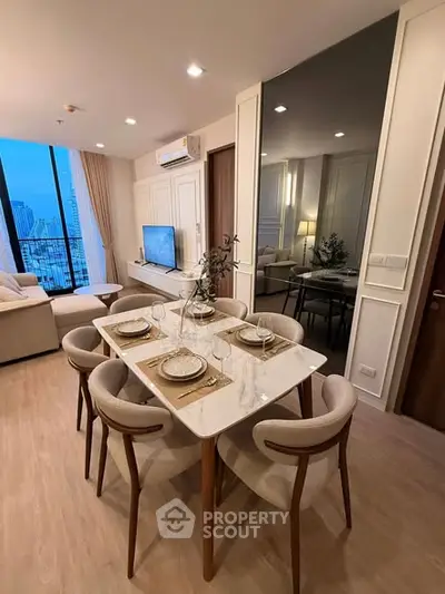 Modern dining area with elegant table setting and city view in luxury apartment