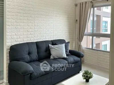 Cozy living room with modern sofa and large window view