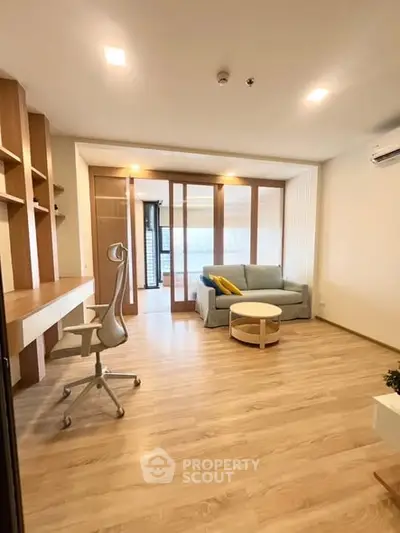 Modern living room with wooden flooring and stylish furniture