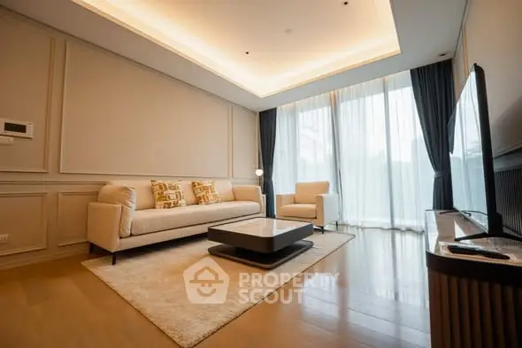 Luxurious modern living room with elegant lighting and stylish furniture.