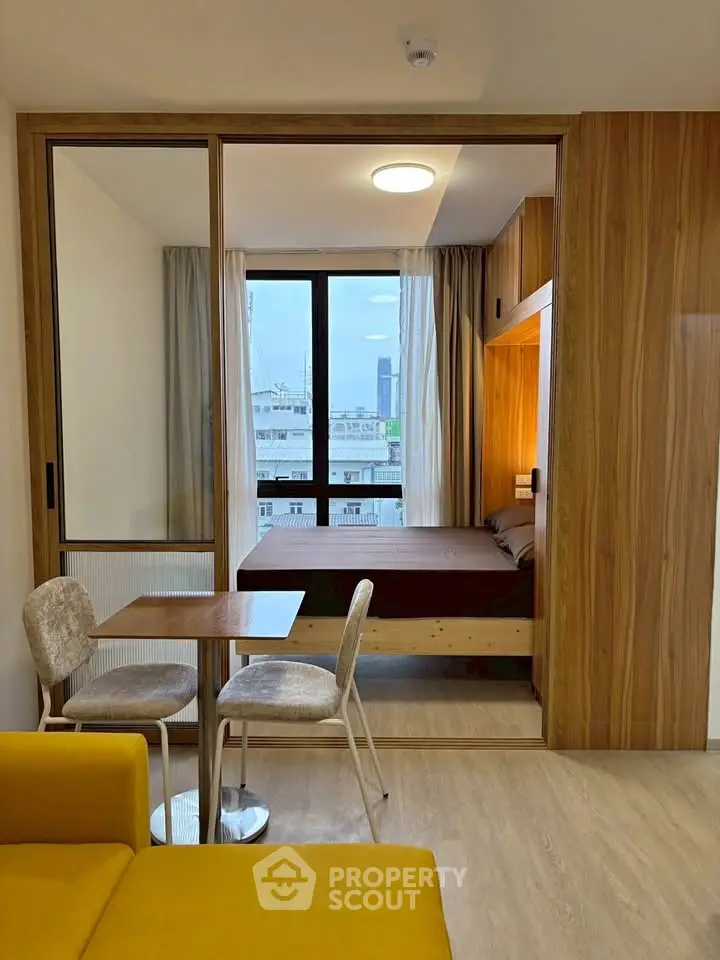 Modern studio apartment with cozy bedroom and stylish dining area