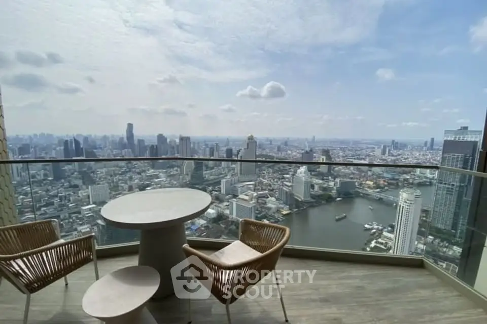 Stunning high-rise balcony with panoramic city and river views, perfect for urban living.