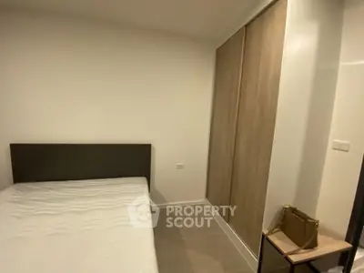 Cozy bedroom with minimalist design and built-in wardrobe