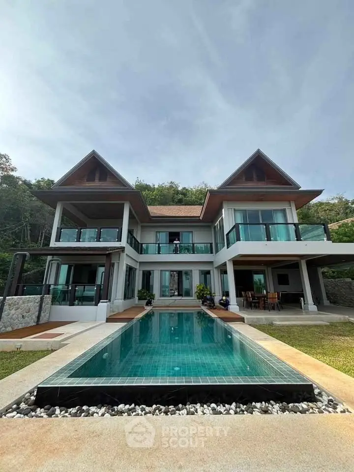 Luxurious modern villa with private pool and stunning architecture in a serene setting.