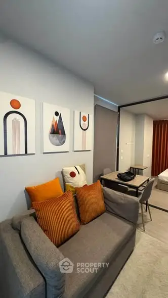 Modern living room with stylish decor and cozy seating area in a contemporary apartment.