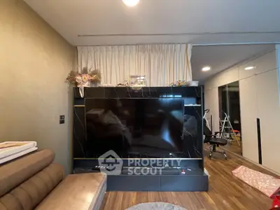 Modern living room with sleek TV unit and stylish decor