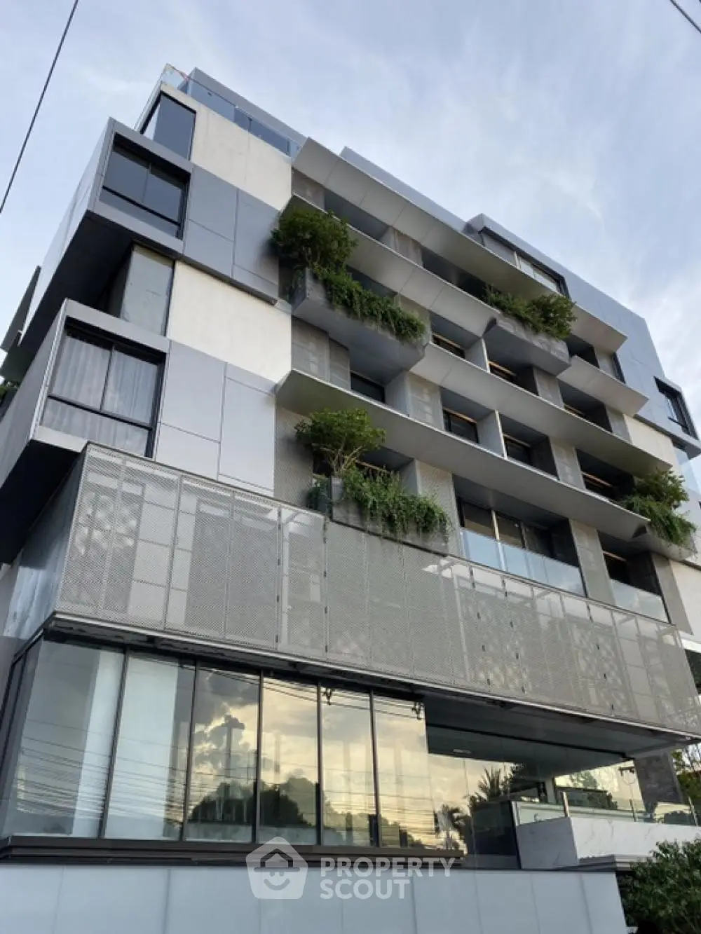 Modern architectural building with sleek design and lush greenery