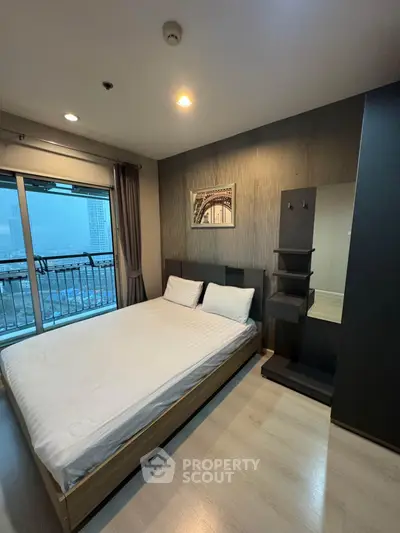 Modern bedroom with balcony view in high-rise apartment
