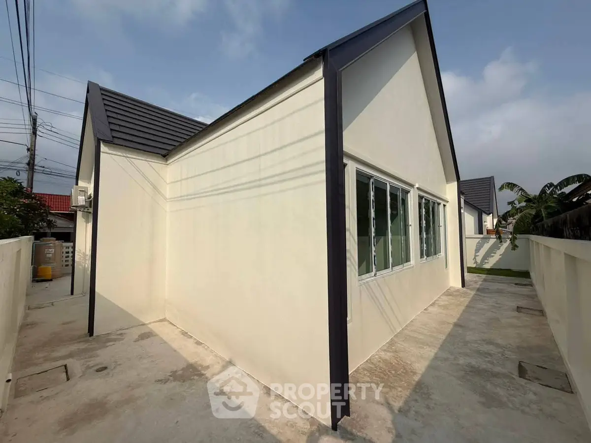 Modern single-story house with sleek design and large windows