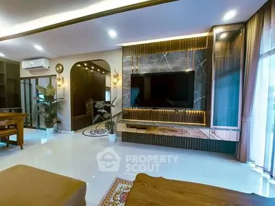 Luxurious modern living room with elegant decor and large TV unit