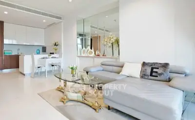 Luxurious modern living room with elegant decor and open kitchen layout