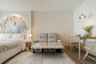 Modern studio apartment with cozy living area and stylish decor