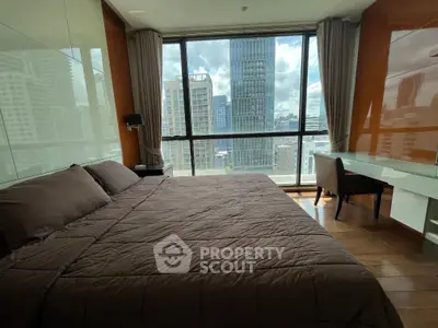 Luxurious bedroom with stunning city view and modern furnishings