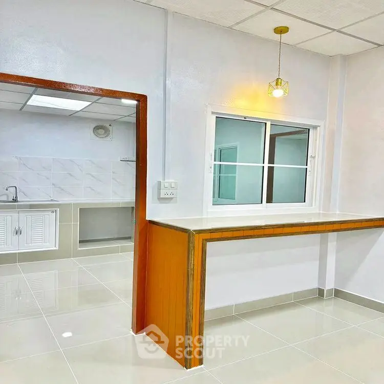 Modern kitchen with open layout and sleek countertops