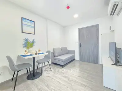 Modern living room with sleek furniture and minimalist decor in a cozy apartment.