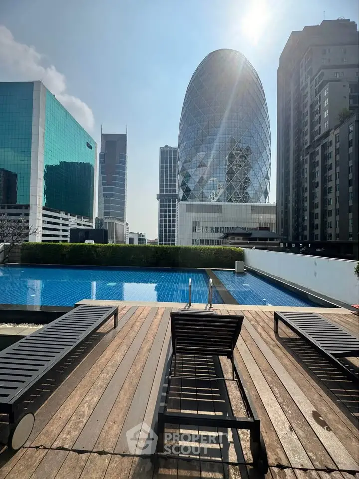 Luxurious rooftop pool with stunning cityscape view and modern architecture.