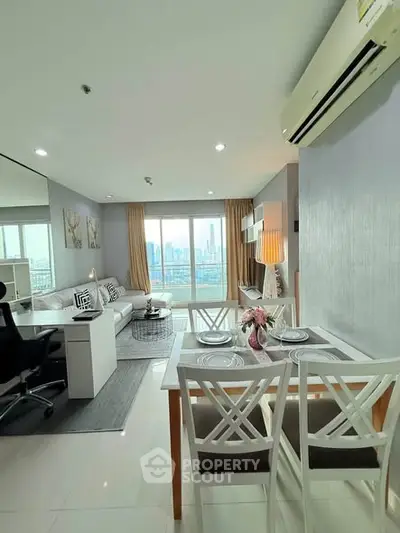 Modern living room with dining area and city view, featuring elegant decor and ample natural light.