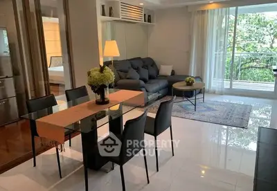 Modern living room with elegant dining area and balcony view