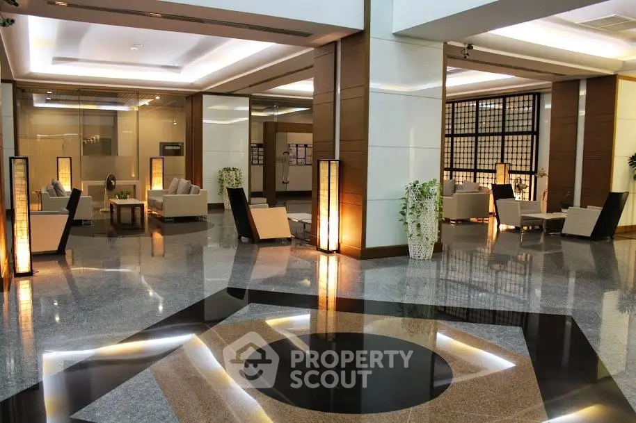 Luxurious modern building entrance with elegant seating and polished floors