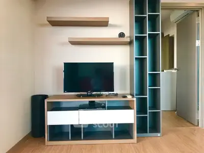 Modern living room with sleek TV stand and open shelving