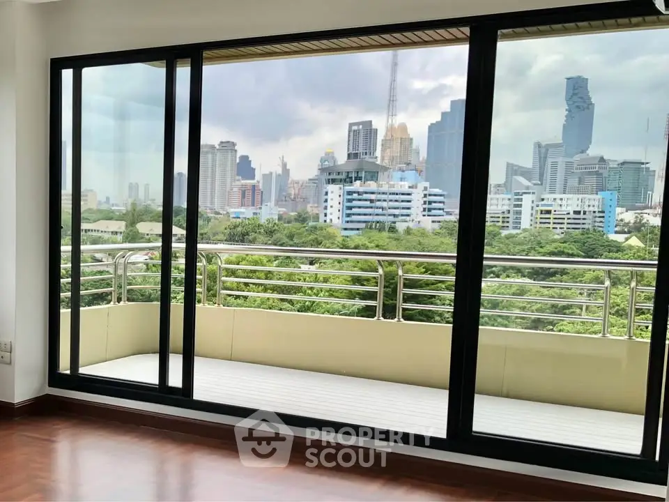 Spacious apartment with stunning city view and large balcony, perfect for urban living.
