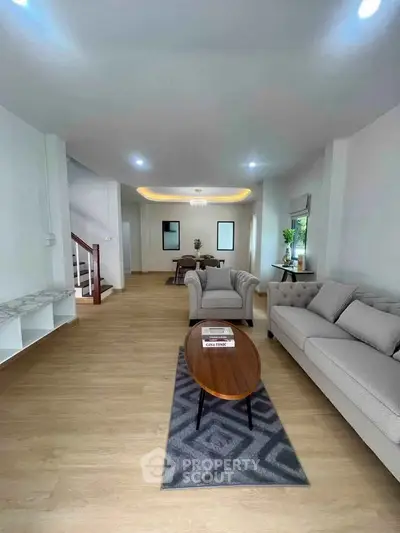 Spacious modern living room with elegant furniture and wooden flooring