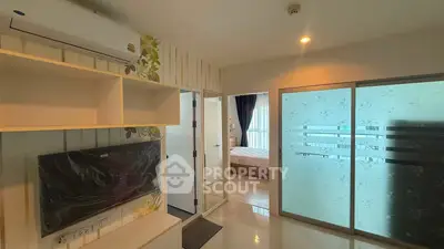 Modern apartment interior with open living space and bedroom view