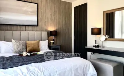 Luxurious bedroom with modern decor and cozy ambiance, featuring elegant lighting and stylish furnishings.