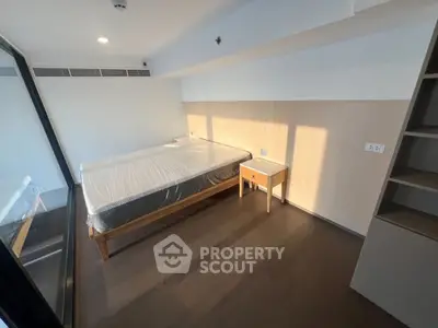 Modern bedroom with large window and wooden furniture, showcasing minimalist design and natural light.