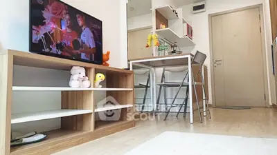 Cozy living room with modern decor and dining area, perfect for relaxation and entertainment.