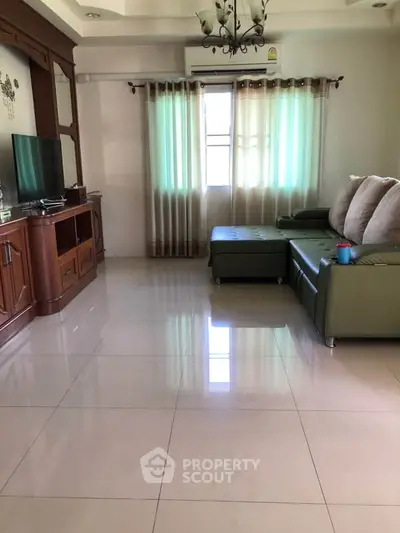 Spacious living room with modern furniture and natural light