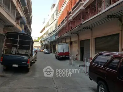 Charming urban street view with parked vehicles and classic architecture