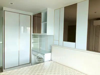Modern bedroom with sleek built-in wardrobe and elegant design