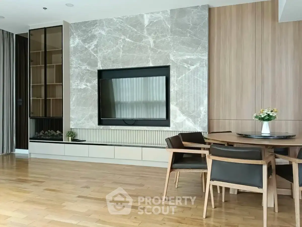 Modern living room with elegant marble wall and stylish dining area