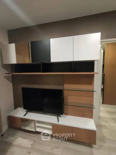 Modern living room with sleek TV unit and stylish shelving